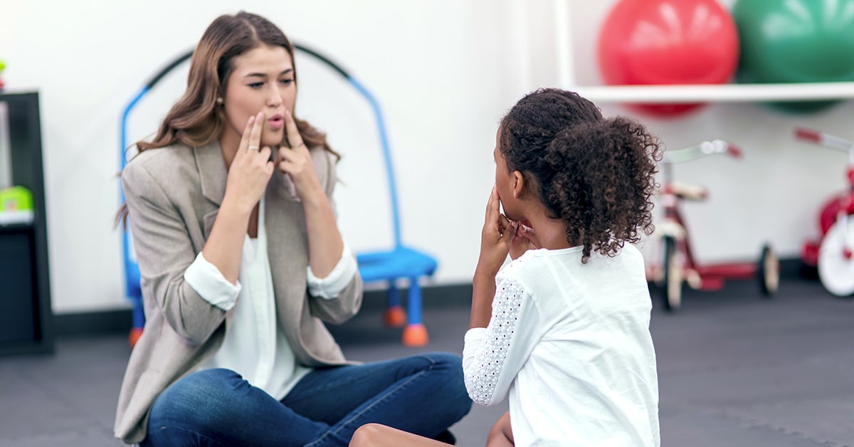 speech therapist working with a child