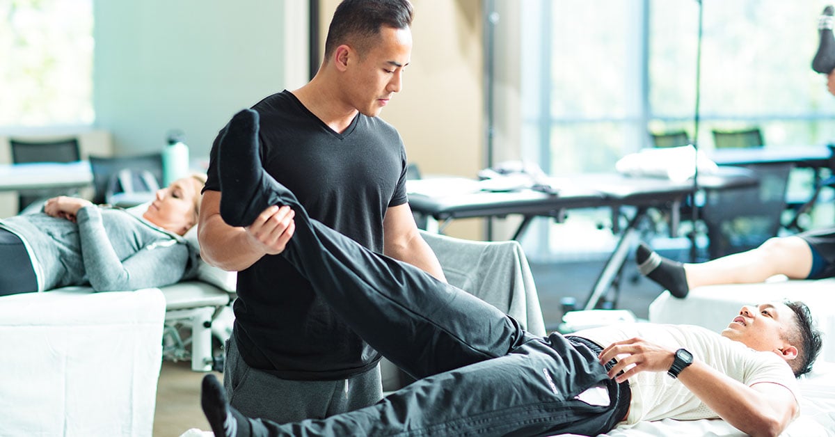 physical therapist working with patients