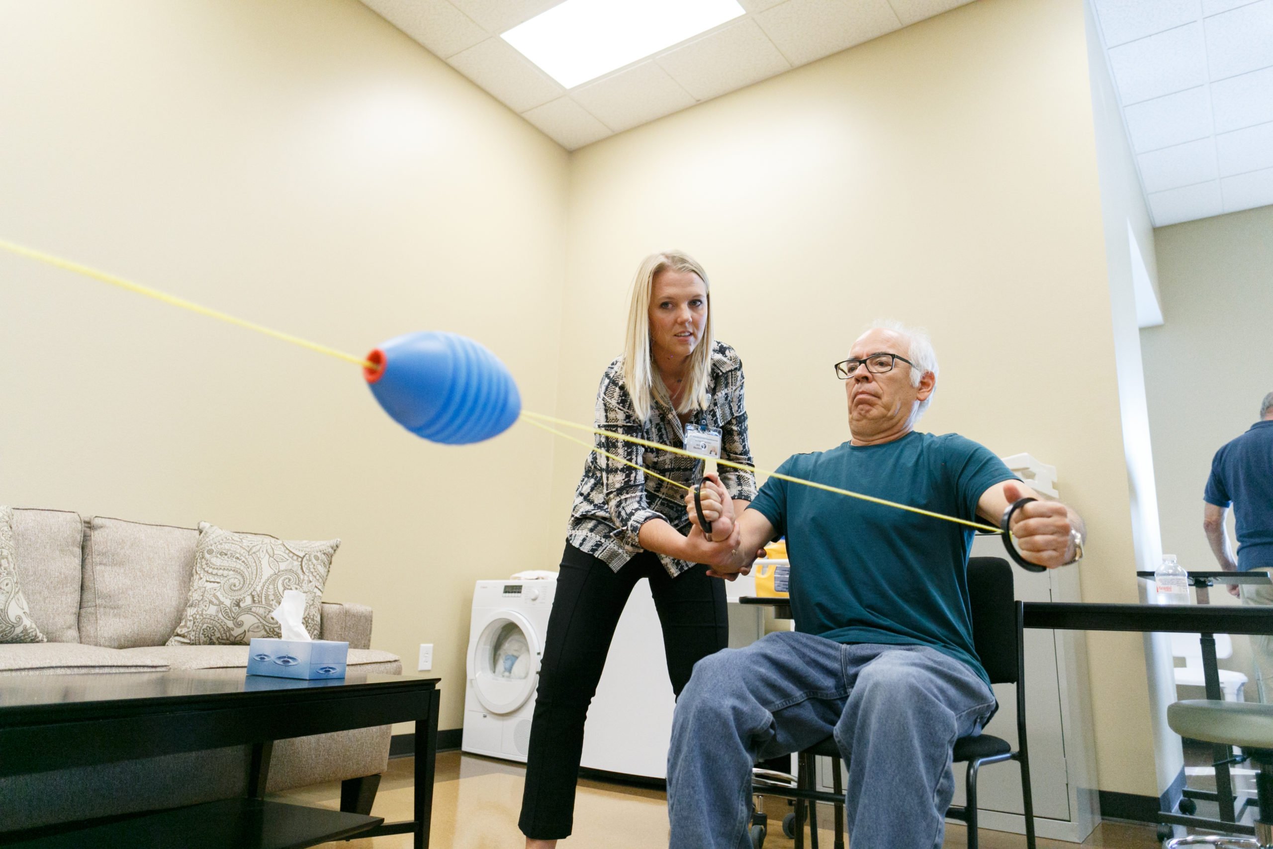 physical therapist working with a patient