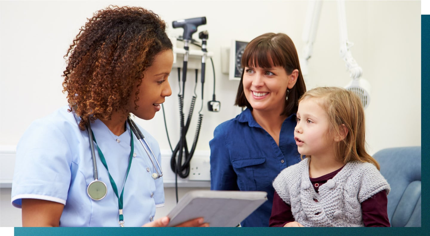 A USAHS nurse practitioner student works with a child patient.