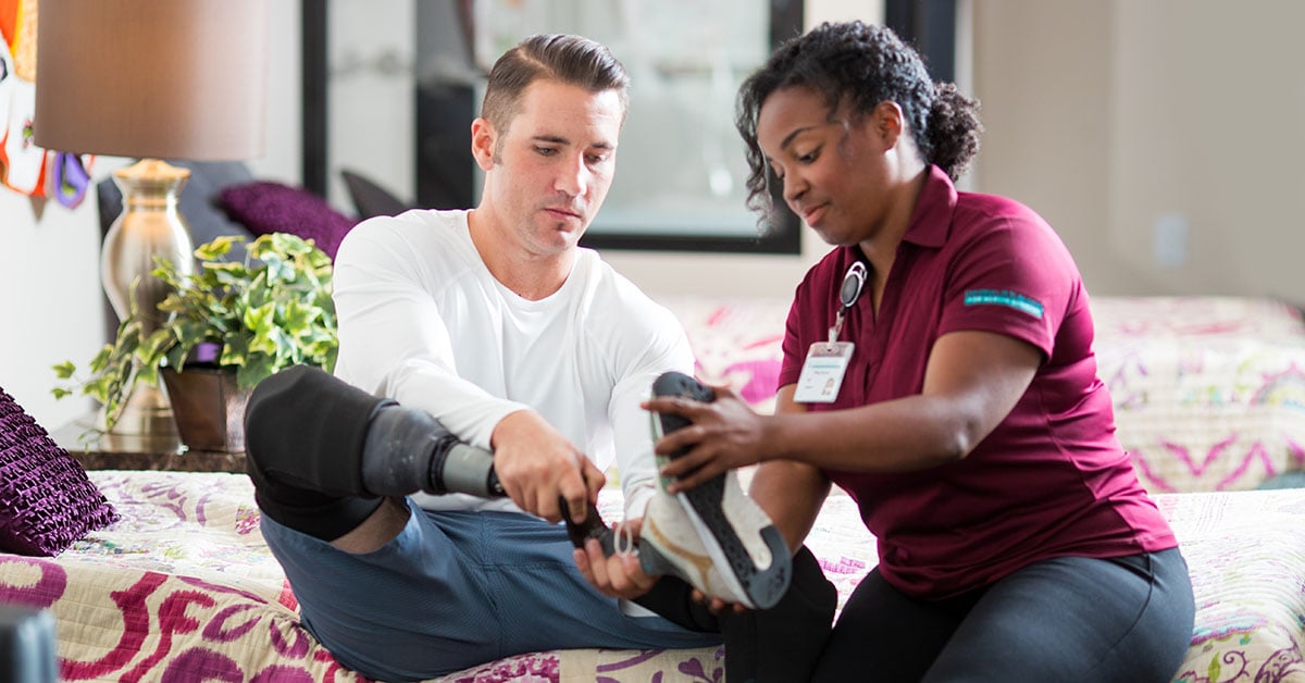 A USAHS physical therapy student works with a patient.