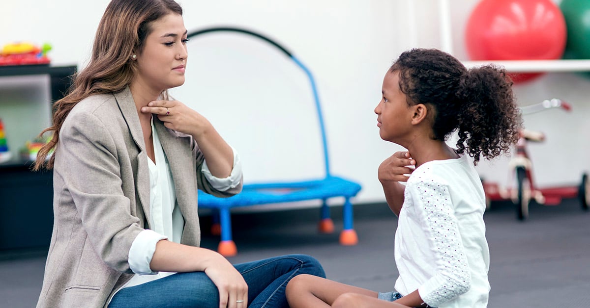 A USAHS speech language pathology student works with a patient.