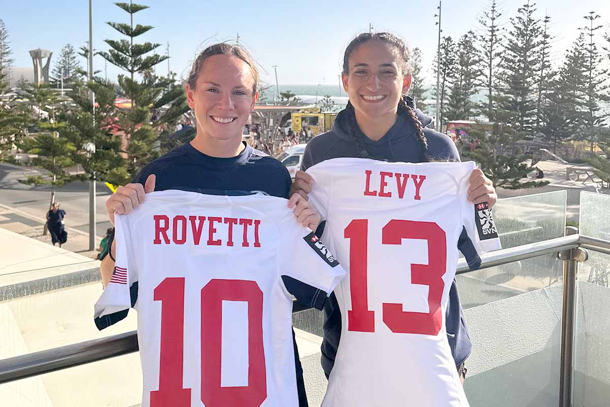 Sarah and Stephanie showing their Jerseys