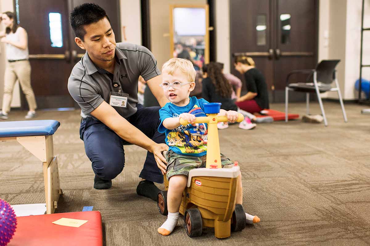 OT student at a workshop with kids