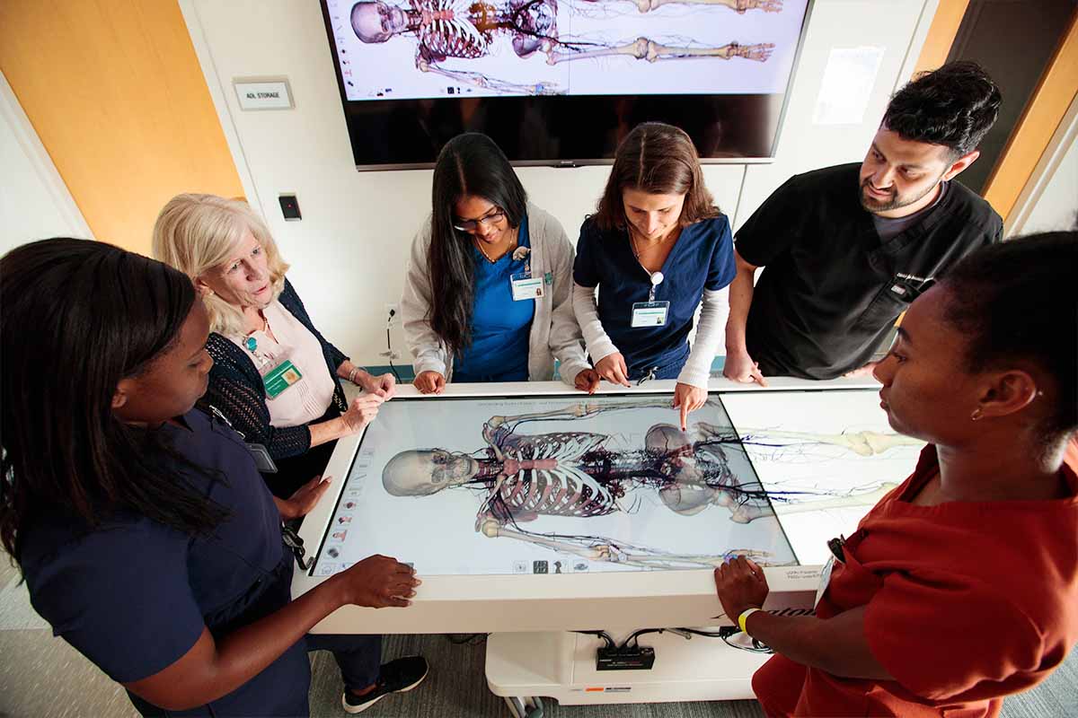 Studetns learning on interactive Anatomage tables at USAHS